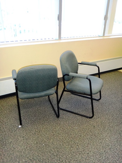 Arm side chairs with sled base.